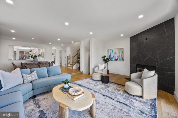 Dining room, Fireplace, Interior, Living room, Marble Walls, Recessed Lighting, Wood Texture Flooring