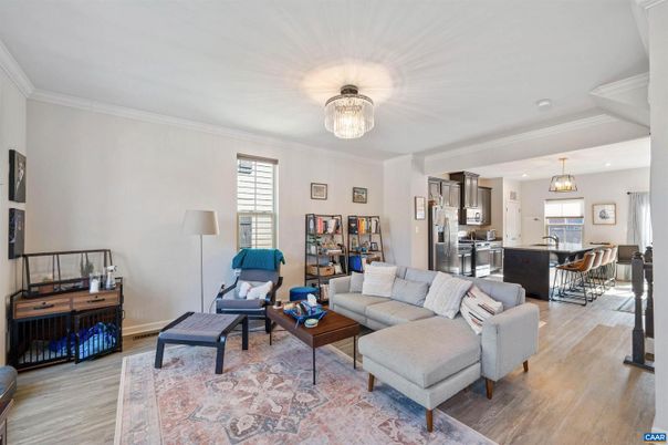 Chandelier, Dining room, Interior, Kitchen, Living room, Pendant Lights, Stainless Steel Appliances, Wood Texture Flooring
