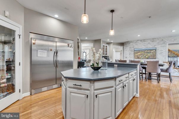 Dining room, Interior, Kitchen, Pendant Lights, Recessed Lighting, Stainless Steel Appliances, Stone Walls, Wood Texture Flooring