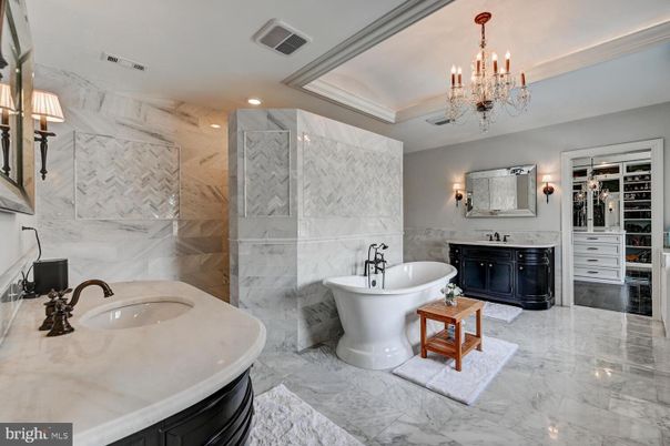 Bathroom, Chandelier, Dual Sink Vanities, Free Standing Baths, Interior, Marble, Marble Walls, Recessed Lighting