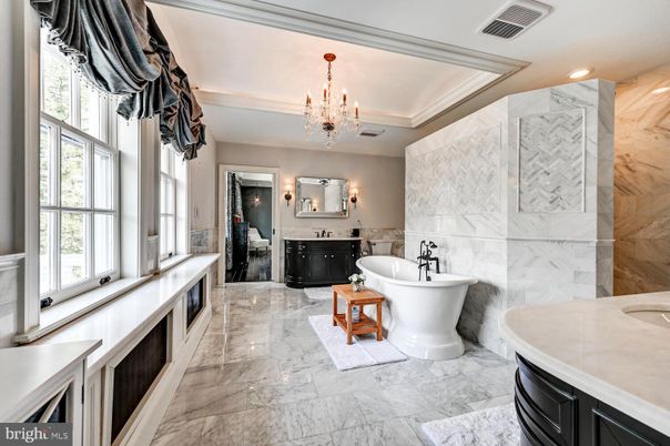 Bathroom, Chandelier, Dual Sink Vanities, Free Standing Baths, Interior, Marble, Marble Walls, Recessed Lighting