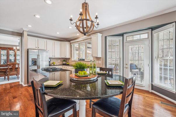Chandelier, Dining room, Interior, Kitchen, Recessed Lighting, Stainless Steel Appliances, Wood Texture Flooring