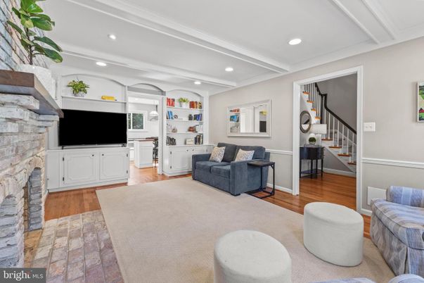 Fireplace, Interior, Living room, Recessed Lighting, Stone Walls, Wood Texture Flooring