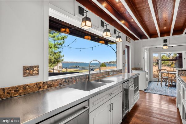 Dining room, Interior, Kitchen, Pendant Lights, Recessed Lighting, Stainless Steel Appliances, Water, Wooden Beams, Wooden Ceilings, Wood Texture Flooring