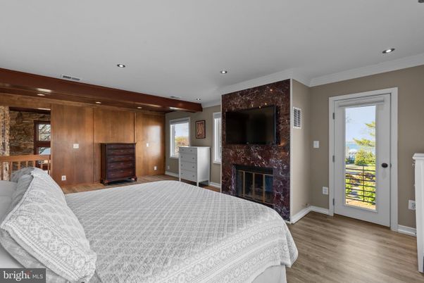 Bedroom, Fireplace, Interior, Recessed Lighting, Wood Texture Flooring