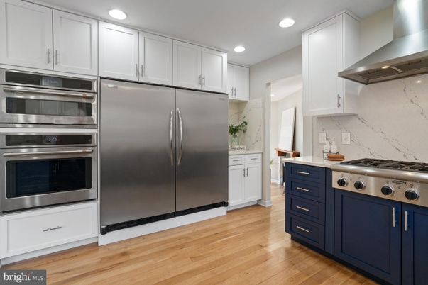 Interior, Kitchen, Marble Walls, Recessed Lighting, Stainless Steel Appliances, Wood Texture Flooring