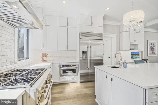 Chandelier, Interior, Kitchen, Pendant Lights, Recessed Lighting, Stainless Steel Appliances, Wood Texture Flooring