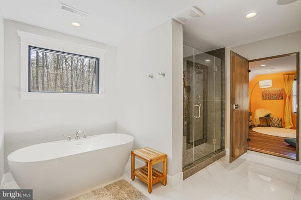 Bathroom, Free Standing Baths, Glass Shower, Interior, Recessed Lighting, Wood Texture Flooring