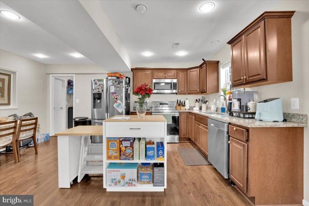 Dining room, Interior, Kitchen, Recessed Lighting, Stainless Steel Appliances, Wood Texture Flooring