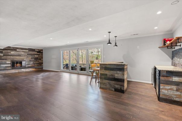 Empty room, Fireplace, Interior, Pendant Lights, Recessed Lighting, Stone Walls, Wood Texture Flooring