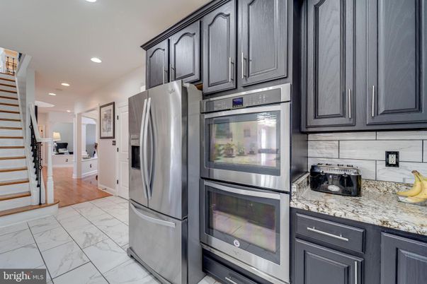 Interior, Kitchen, Marble, Recessed Lighting, Stainless Steel Appliances, Wood Texture Flooring