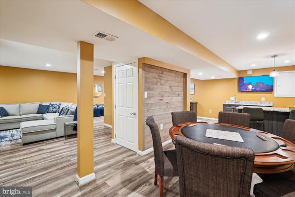Dining room, Game Room, Interior, Living room, Pendant Lights, Recessed Lighting, Wood Texture Flooring