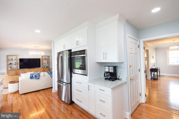 Chandelier, Interior, Kitchen, Living room, Recessed Lighting, Stainless Steel Appliances, Wood Texture Flooring