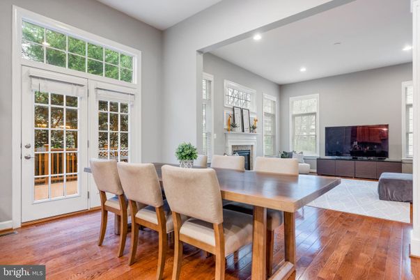 Dining room, Fireplace, Interior, Living room, Recessed Lighting, Wood Texture Flooring