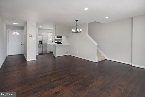 Chandelier, Empty room, Interior, Kitchen, Recessed Lighting, Stainless Steel Appliances, Wood Texture Flooring