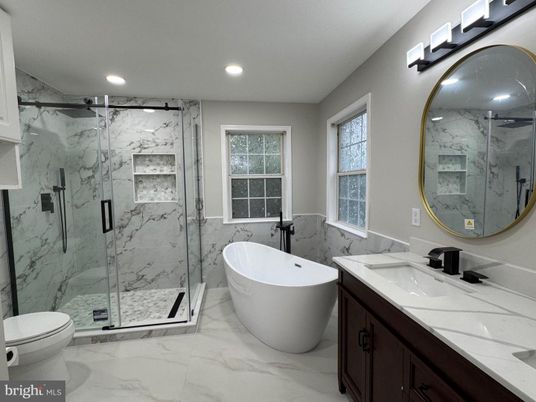 Bathroom, Dual Sink Vanities, Free Standing Baths, Glass Shower, Interior, Marble, Marble Walls, Recessed Lighting