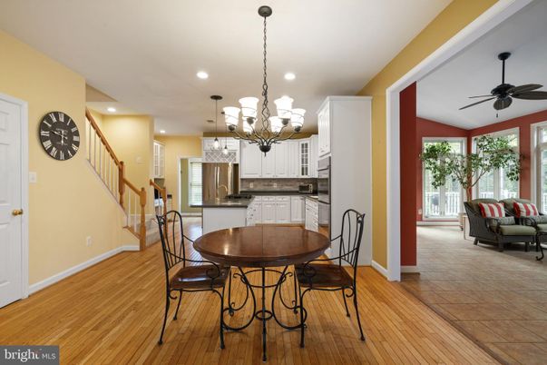 Chandelier, Dining room, Interior, Kitchen, Pendant Lights, Recessed Lighting, Stainless Steel Appliances, Wood Texture Flooring