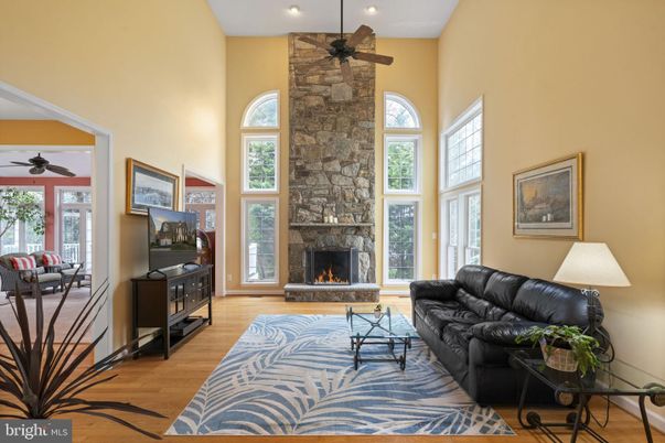 Fireplace, Interior, Living room, Recessed Lighting, Stone Walls, Wood Texture Flooring
