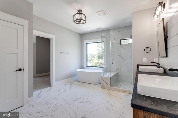 Bathroom, Dual Sink Vanities, Free Standing Baths, Glass Shower, Interior, Marble, Marble Walls, Recessed Lighting