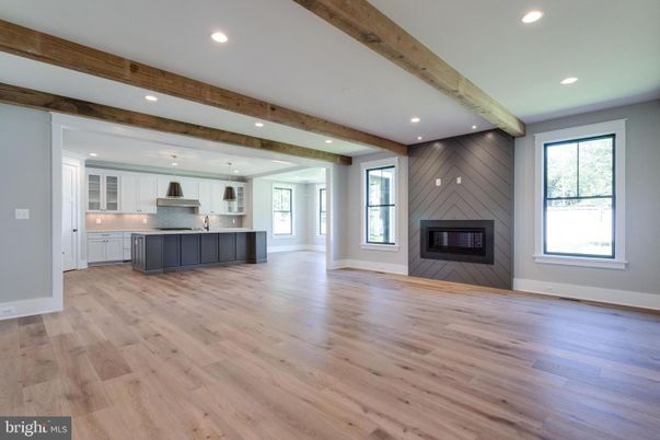 Empty room, Fireplace, Interior, Kitchen, Pendant Lights, Recessed Lighting, Wooden Beams, Wood Texture Flooring