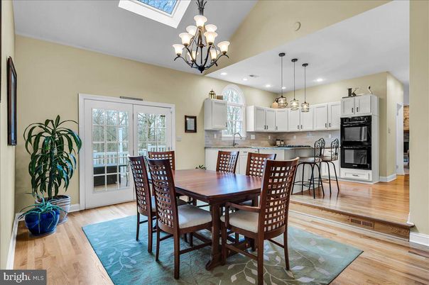 Chandelier, Dining room, Interior, Kitchen, Pendant Lights, Recessed Lighting, Stainless Steel Appliances, Wood Texture Flooring
