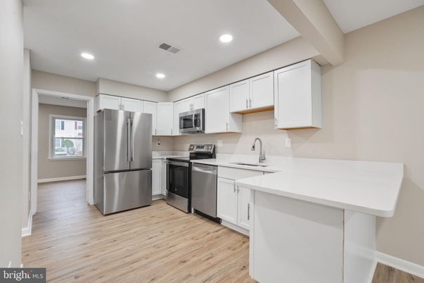 Interior, Kitchen, Recessed Lighting, Stainless Steel Appliances, Wood Texture Flooring