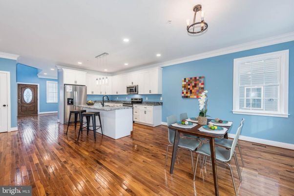 Dining room, Interior, Kitchen, Pendant Lights, Recessed Lighting, Stainless Steel Appliances, Wood Texture Flooring