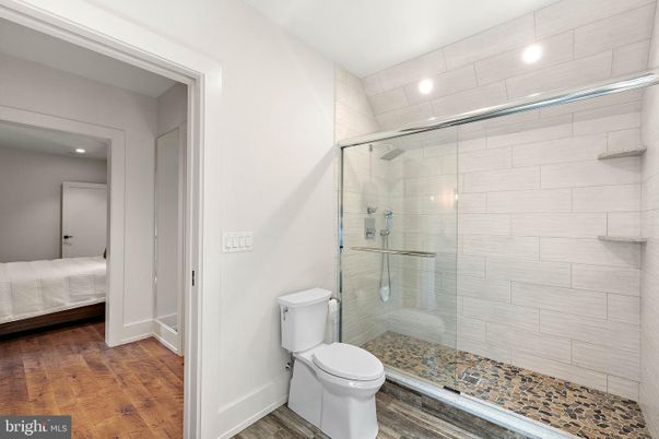 Bathroom, Bedroom, Glass Shower, Interior, Recessed Lighting, Wood Texture Flooring