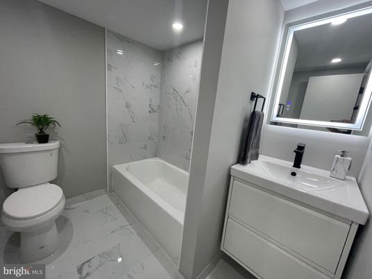 Bathroom, Dual Sink Vanities, Interior, Marble, Marble Walls, Recessed Lighting