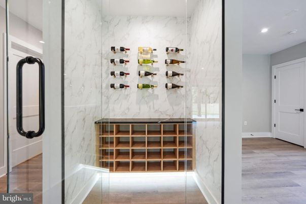 Interior, Marble Walls, Recessed Lighting, Wine Storage, Wood Texture Flooring