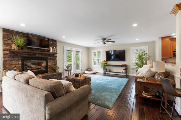 Fireplace, Interior, Living room, Recessed Lighting, Stone Walls, Wood Texture Flooring