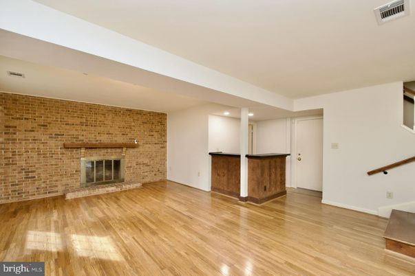 Empty room, Fireplace, Interior, Recessed Lighting, Stone Walls, Wood Texture Flooring