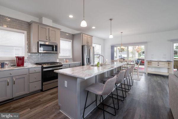 Dining room, Interior, Kitchen, Pendant Lights, Recessed Lighting, Stainless Steel Appliances, Wood Texture Flooring