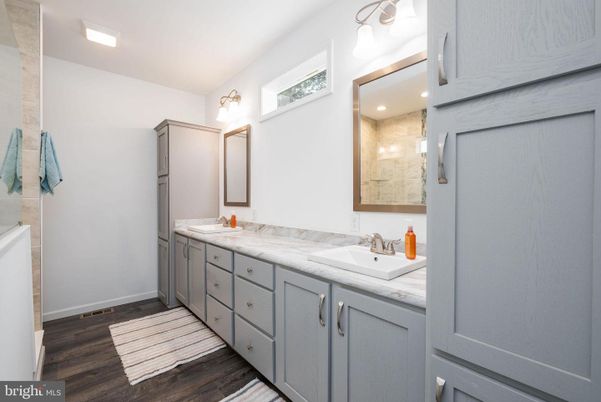 Bathroom, Dual Sink Vanities, Interior, Recessed Lighting, Wood Texture Flooring
