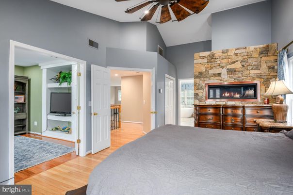 Bedroom, Fireplace, Interior, Recessed Lighting, Stone Walls, Wood Texture Flooring