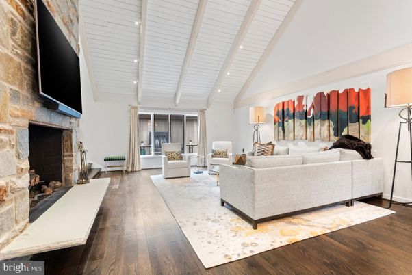 Fireplace, Interior, Living room, Recessed Lighting, Stone Walls, Wood Texture Flooring