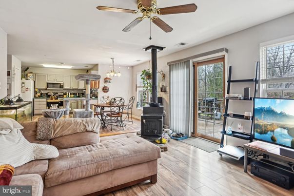 Chandelier, Dining room, Fireplace, Interior, Kitchen, Living room, Recessed Lighting, Stainless Steel Appliances, Wood Texture Flooring
