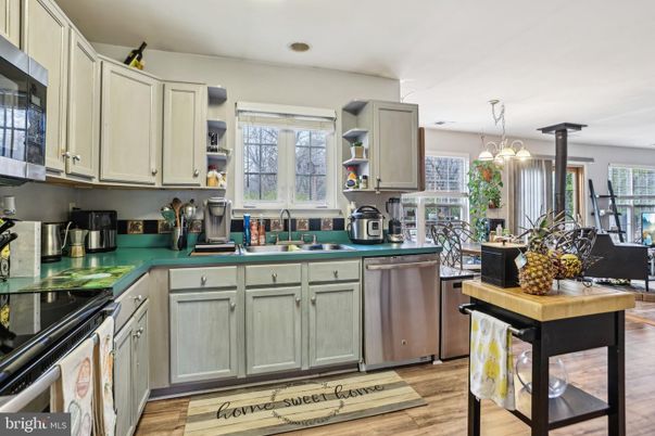 Dining room, Interior, Kitchen, Pendant Lights, Recessed Lighting, Stainless Steel Appliances, Wood Texture Flooring