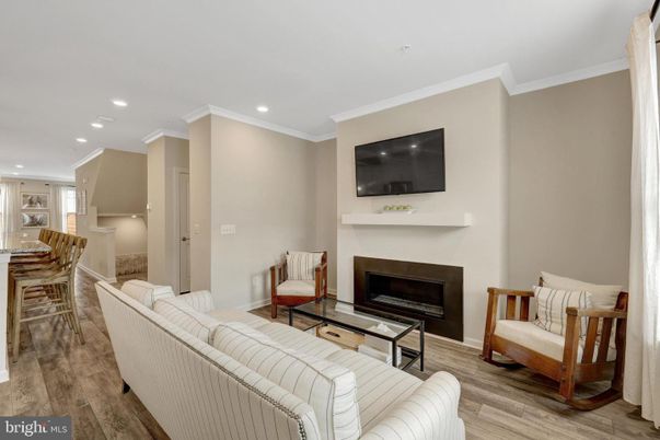Dining room, Fireplace, Interior, Living room, Recessed Lighting, Wood Texture Flooring