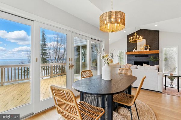 Chandelier, Dining room, Fireplace, Interior, Living room, Recessed Lighting, Water, Wood Texture Flooring