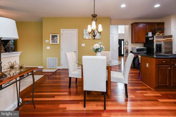 Chandelier, Dining room, Interior, Kitchen, Pendant Lights, Recessed Lighting, Stainless Steel Appliances, Wood Texture Flooring