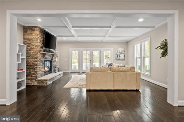 Fireplace, Interior, Living room, Recessed Lighting, Stone Walls, Wood Texture Flooring