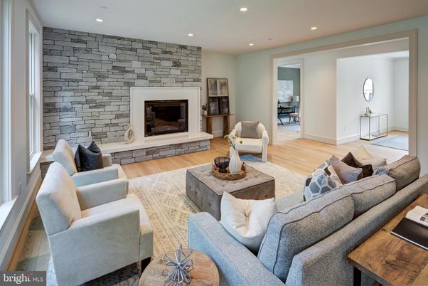 Fireplace, Interior, Living room, Recessed Lighting, Stone Walls, Wood Texture Flooring