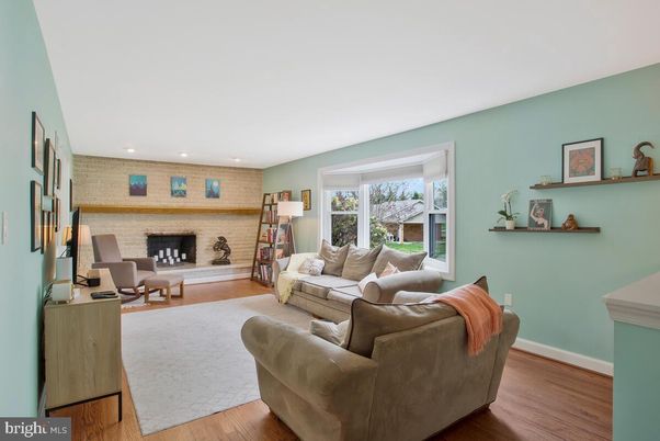 Fireplace, Interior, Living room, Recessed Lighting, Stone Walls, Wood Texture Flooring