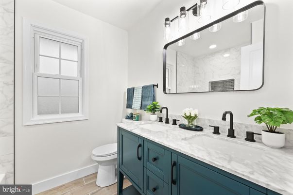 Bathroom, Dual Sink Vanities, Interior, Marble Walls, Wood Texture Flooring