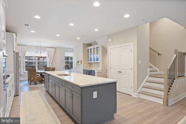 Chandelier, Dining room, Interior, Kitchen, Pendant Lights, Recessed Lighting, Stainless Steel Appliances, Wood Texture Flooring