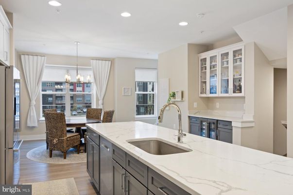 Chandelier, Dining room, Interior, Kitchen, Pendant Lights, Recessed Lighting, Stainless Steel Appliances, Wood Texture Flooring