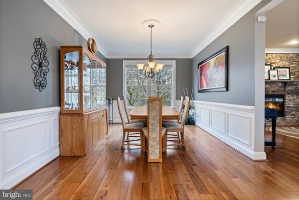 Chandelier, Dining room, Fireplace, Interior, Stone Walls, Wood Texture Flooring