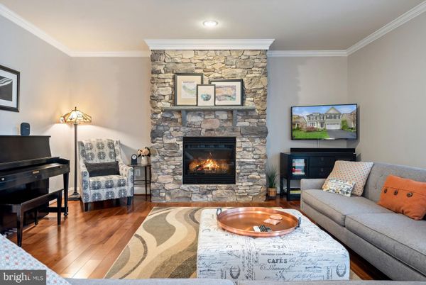Fireplace, Interior, Living room, Piano, Recessed Lighting, Stone Walls, Wood Texture Flooring