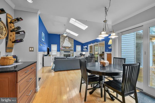 Dining room, Fireplace, Interior, Living room, Pendant Lights, Recessed Lighting, Stone Walls, Wood Texture Flooring